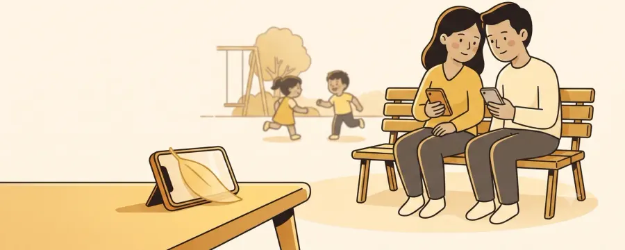 Two parents sitting side by side on a park bench, each holding a phone and comparing the two screens, while their children play on a slide behind them and a tablet rests propped on a stand in the foreground.