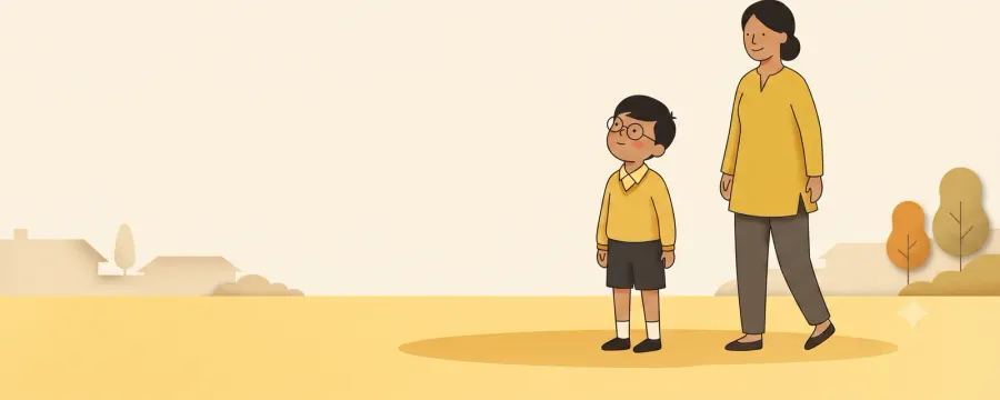 A young boy wearing round glasses standing outdoors in an open field beside a parent, looking up at a kite in the sky.